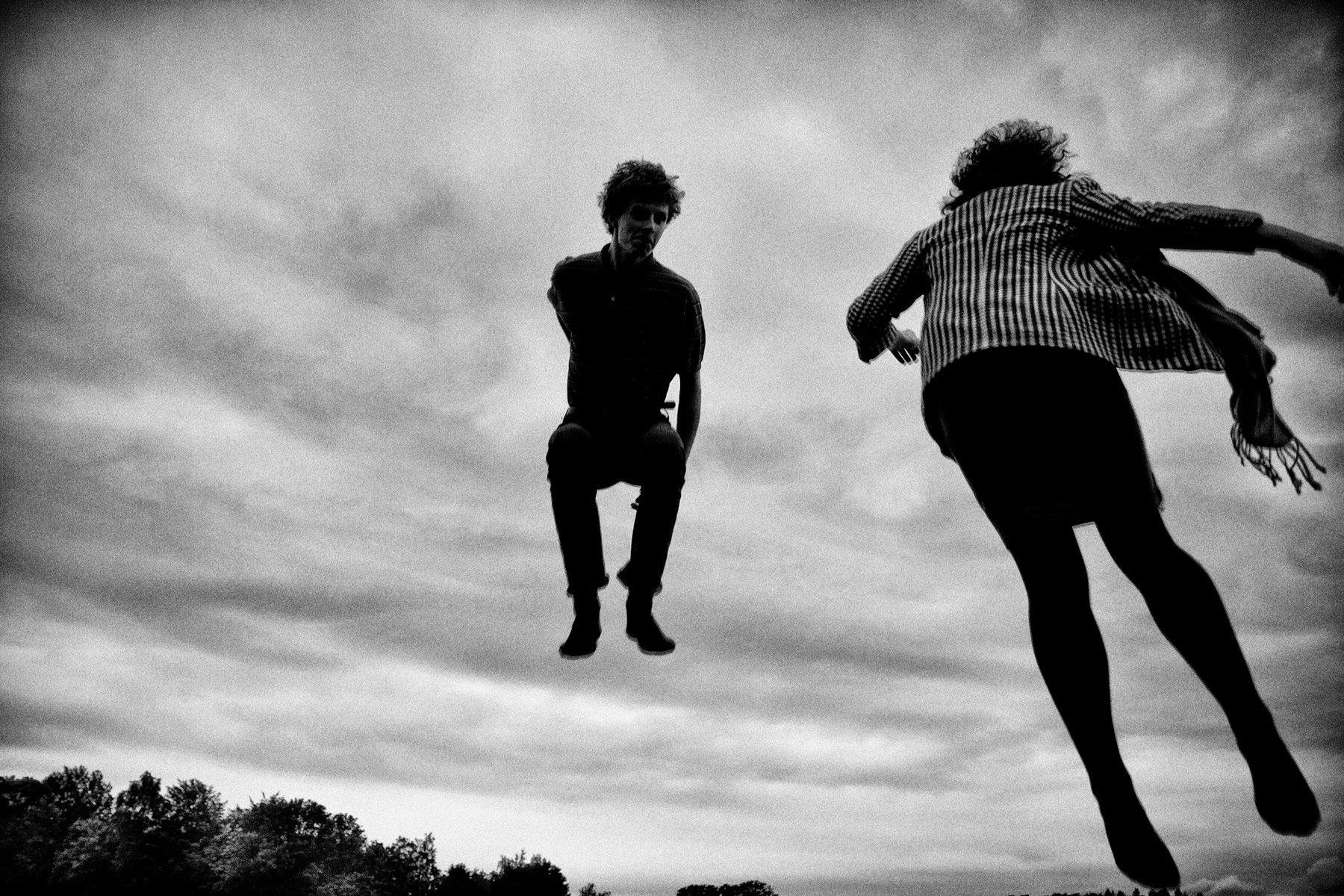 Playing and jumping on a trampoline during the danish summer